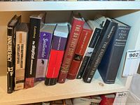 Front view of all books on middle shelf