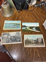 All four postcards front view on table