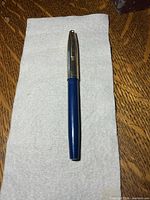 Full view of pen closed on cloth