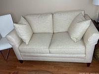Front view of Stickley loveseat with cushions