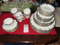 Stacked dinner, salad, dessert plates, fruit nappies, cups and saucers