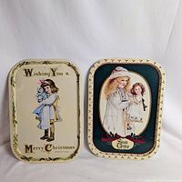 Front view of both holiday trays showing graphics and borders