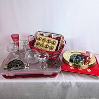 Group shot of entire lot on tray showing chargers, ornaments, glassware, basket, and metal piece