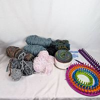 Full lot view showing yarn, round looms, rectangular loom, hook and instructions