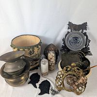 Full lot with brass spittoons, wastebasket, shelf, jars, silhouettes, frame, pinecone and ornament