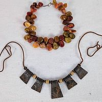 Both necklaces laid out showing overall design and materials