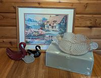 Group view showing bowl, framed print and three swan figurines