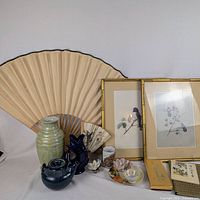 Group shot showing all items including fans, vase, gluggle jug, teapot, framed prints, tote and small décor