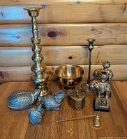 Group shot of all eight brass items