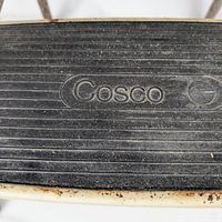 Close-up of Cosco logo on black rubber tread