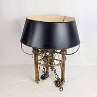 Full view of Bouillotte lamp with black shade and brass body