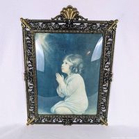 Front view showing artwork, bubble glass and ornate frame