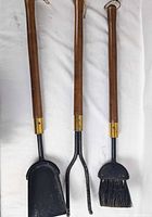 Full view of the three fireplace tools aligned side by side