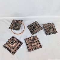 Five plastic bathroom fixture pieces displayed face up