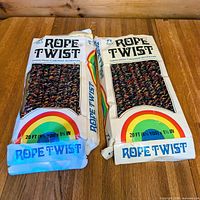 Front view of two Rope Twist garland boxes showing product name, graphics, and contents