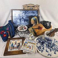 Group shot of entire lot showing tray, clog, trivets, vest, ceramics, tiles and book