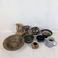 Group shot showing all eight pottery pieces
