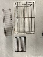 all three grates laid out to show relative sizes and designs