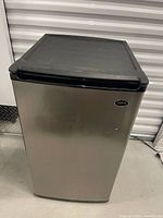 Front view of Sanyo stainless steel mini fridge