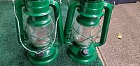 Two green battery lanterns side by side