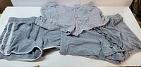 All three gray shorts laid flat