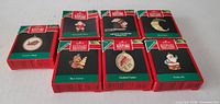 Front view of six boxed Hallmark miniature ornaments