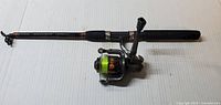 Full view of telescoping rod with attached spinning reel