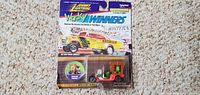 Front of sealed Johnny Lightning Wacky Winners blister card showing car, artwork and series details