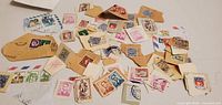 Wide view of scattered used stamps and envelope pieces