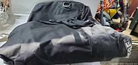 Top view of folded black Reese rooftop cargo bag