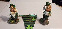 Both leprechaun figurines and pennant displayed front view