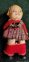 Full view of Campbell's Soup Kid doll in Scottish kilt outfit