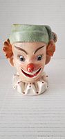 Front view of Napcoware clown head planter showing facial details and collar