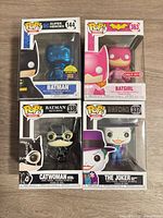 Front view of all four boxed Funko Pop figures