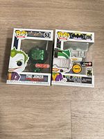 Front view of both Funko Pop! Joker figures in boxes showing exclusivity stickers