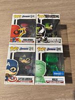 Front view of four boxed Funko Pop figures