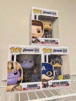 Front view of three boxed Funko Pop figures stacked