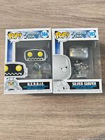 Front view of both boxed figures