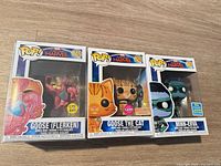 Front view of three boxed Funko Pop! figures