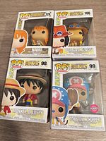 Front view of all four boxed Funko Pop One Piece figures