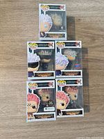 Front view showing five boxed Funko Pop figures stacked