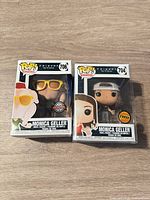 Front view of both boxed figures showing window displays and variant numbers 706 and 704