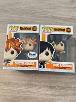 Front view of both boxed figures