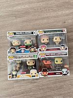 Front view of four sealed Funko Pop! 2-pack boxes