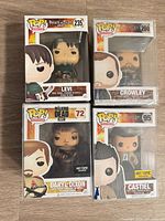 Front view of four boxed Funko Pop figures showing characters and numbers