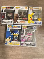 Front view of all five boxed Funko Pop! figures