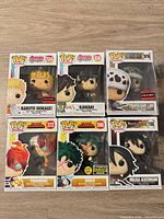 Front view of six boxed Funko Pop figures showing characters and exclusives