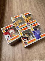 Grouped view of four Funko Pop McDonald’s figures in boxes