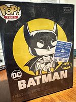 Front of sealed Batman Pop! Tee box