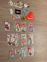 Full lot overview showing loose stickers, bagged sticker sets and keychain